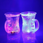Group of flashing LED cups on a table, creating a vibrant party atmosphere.