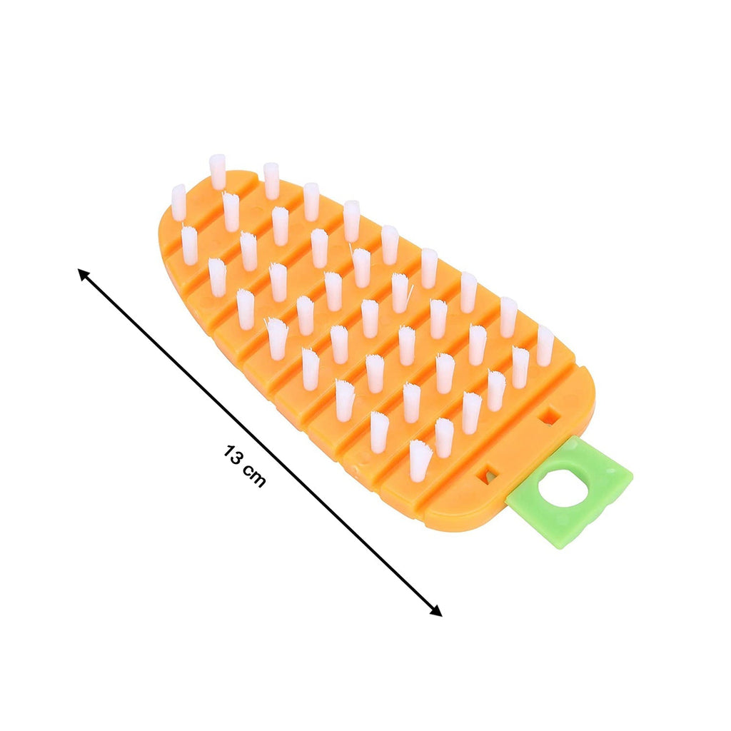 Vegetable scrubbing brush displayed with fresh corn and potatoes.