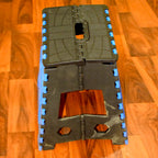 A person standing confidently on the 18-inch plastic step stool to reach a top kitchen cabinet.