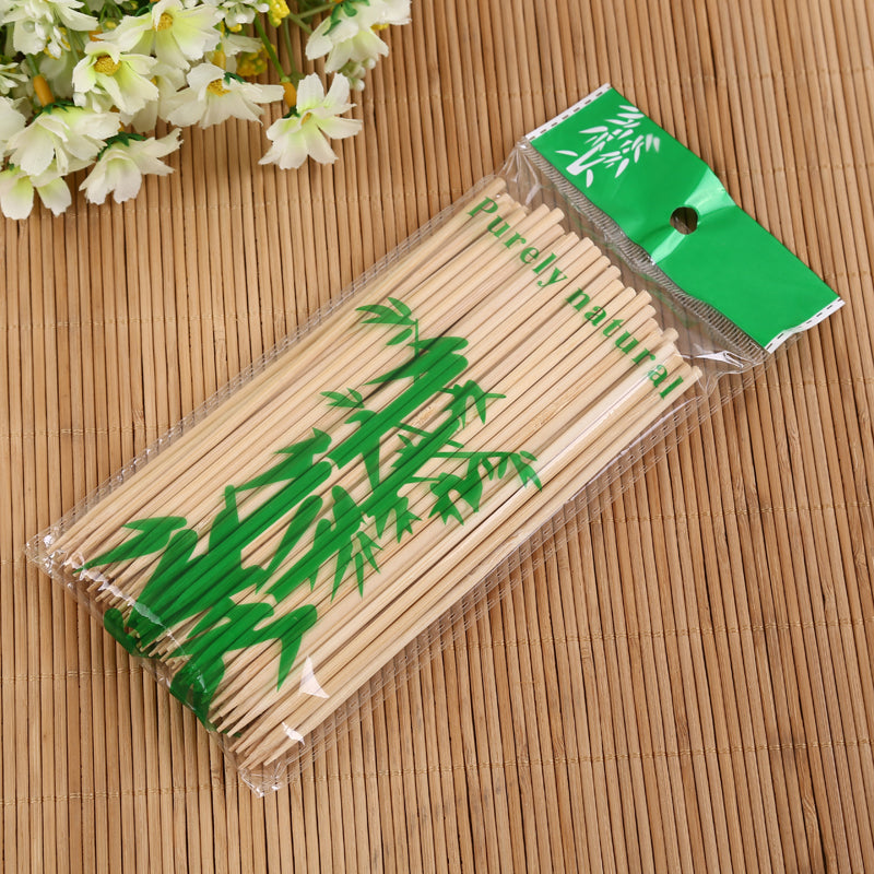 Natural bamboo skewers in clear packaging, ready for retail.