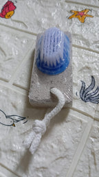 Top-down view of the XcelCraft pumice stone foot scrubber, highlighting its two effective surfaces.
