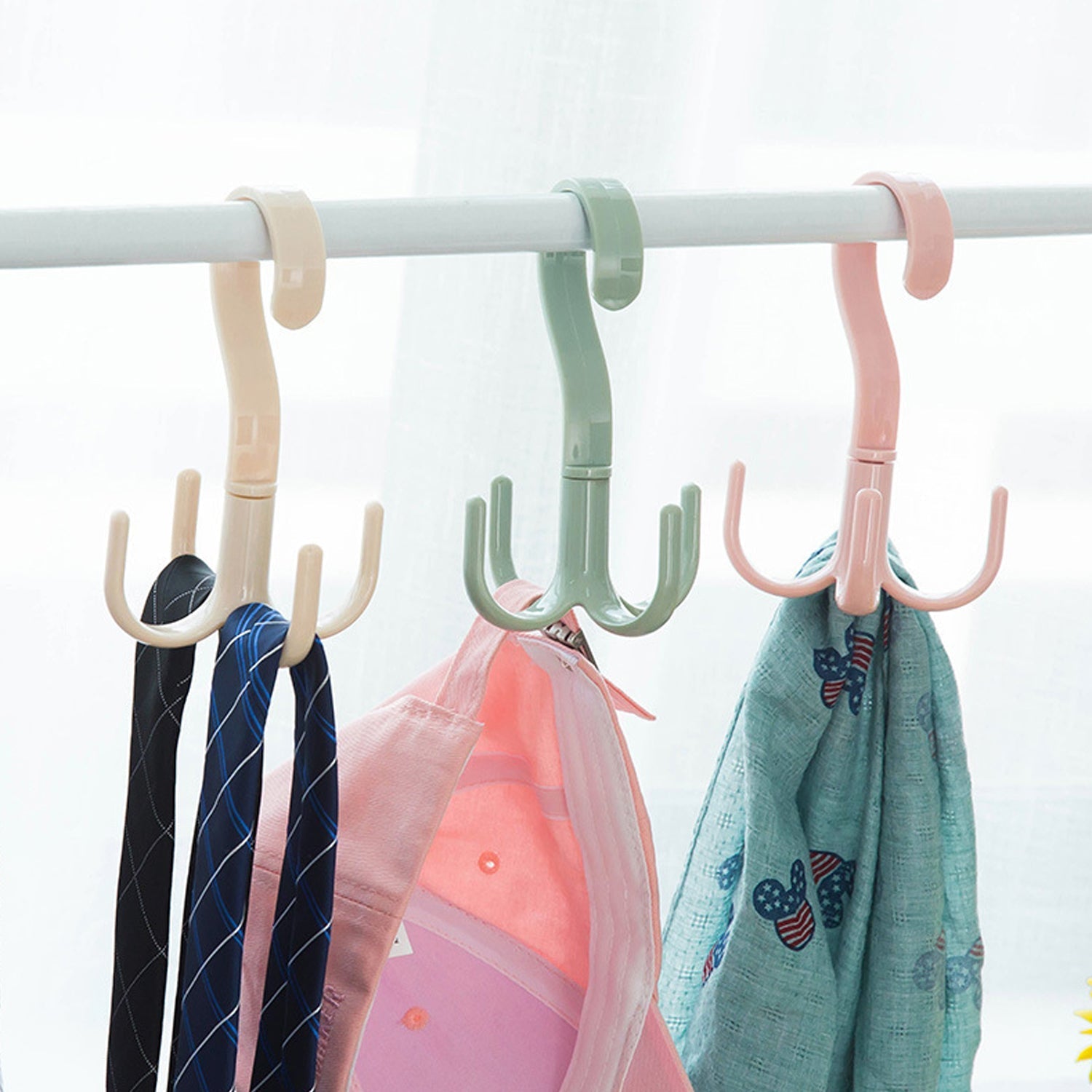 A brown handbag neatly hung on the 360-degree rotatable purse hanger hook, demonstrating its utility.