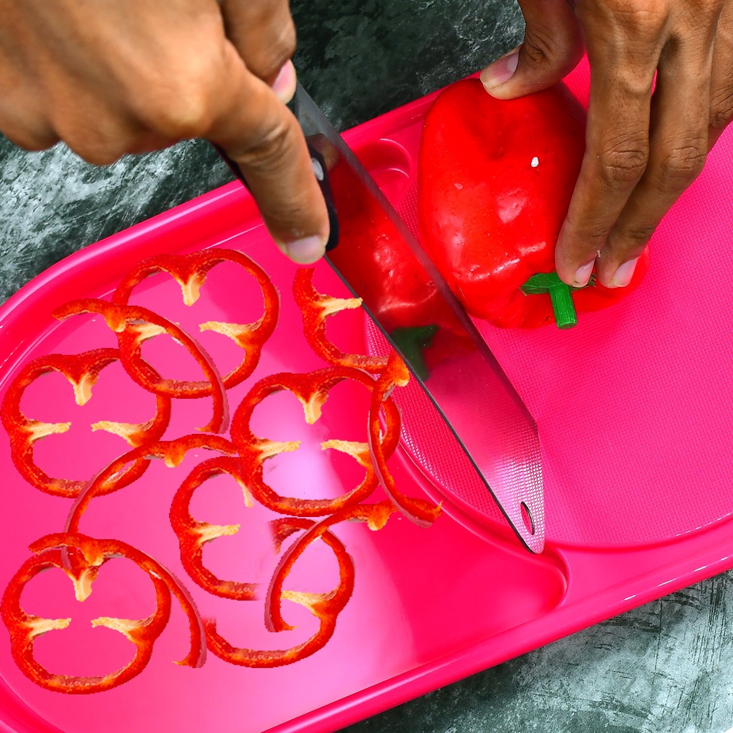 Side view of the Quickslice plastic chopping board with a full tray.