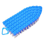A flexible cleaning brush effectively cleaning around a bathroom faucet, reaching tricky corners.