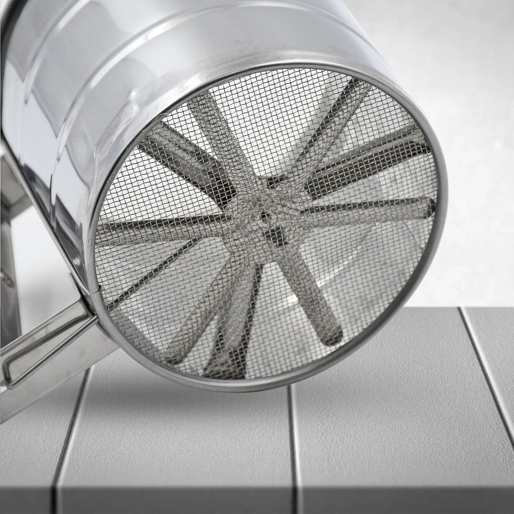 Multipurpose stainless steel flour sifter, an essential kitchen tool for baking.