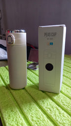 Close-up of the durable stainless steel construction and secure lid of the Bottlart water bottle.