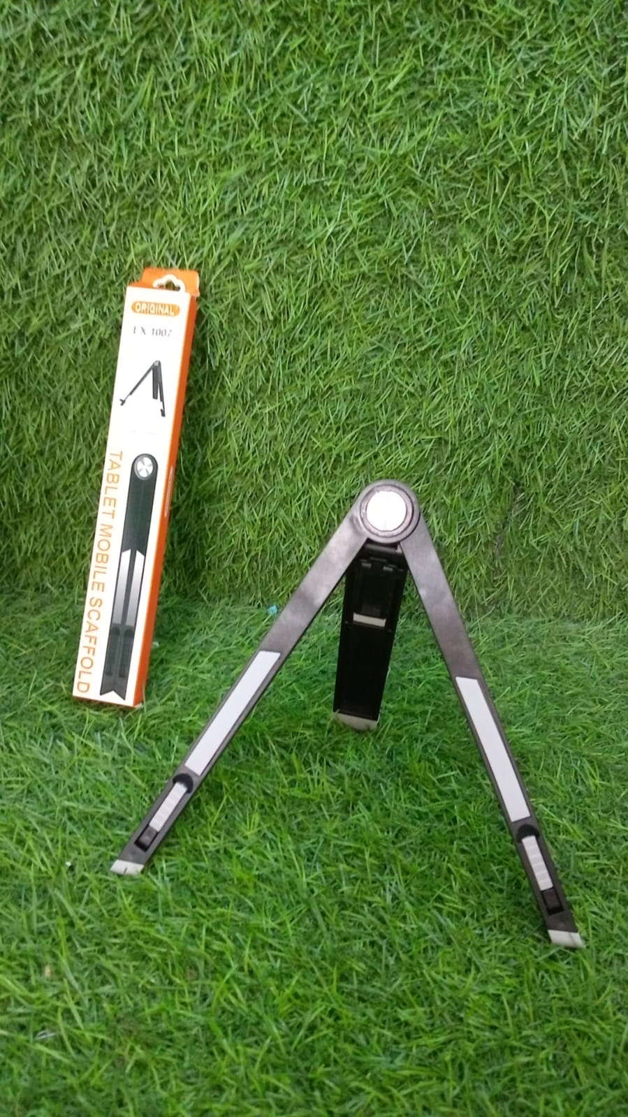 The versatile tablet stand placed on a desk, ready to hold a mobile or tablet.