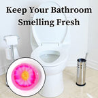 Compact floral-scented air freshener block, ideal for small toilet spaces.
