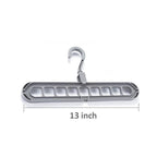 Close-up view of the nine precisely designed holes on the plastic hanger for secure garment storage.