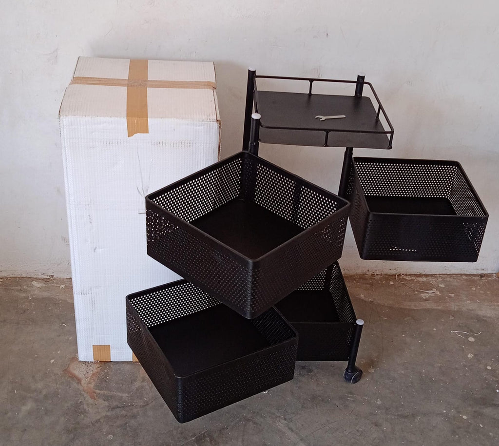 An assembled metal kitchen trolley with wheels, neatly holding various kitchen accessories.