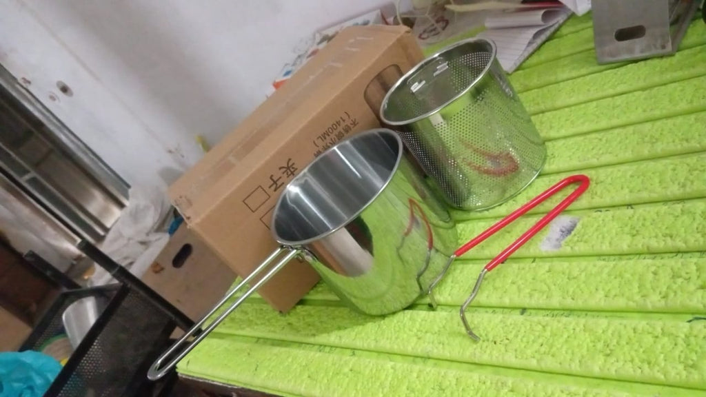 Close-up of the polished stainless steel surface of the FirePot deep frying pot.