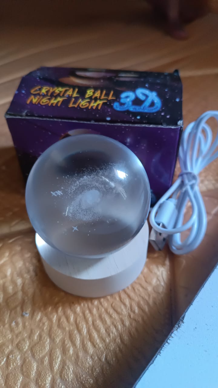 Elegant 3D Crystal Ball Lamp providing calming soft ambient light in a room.