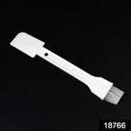 Small dust cleaning brush effectively cleaning keyboard keys.