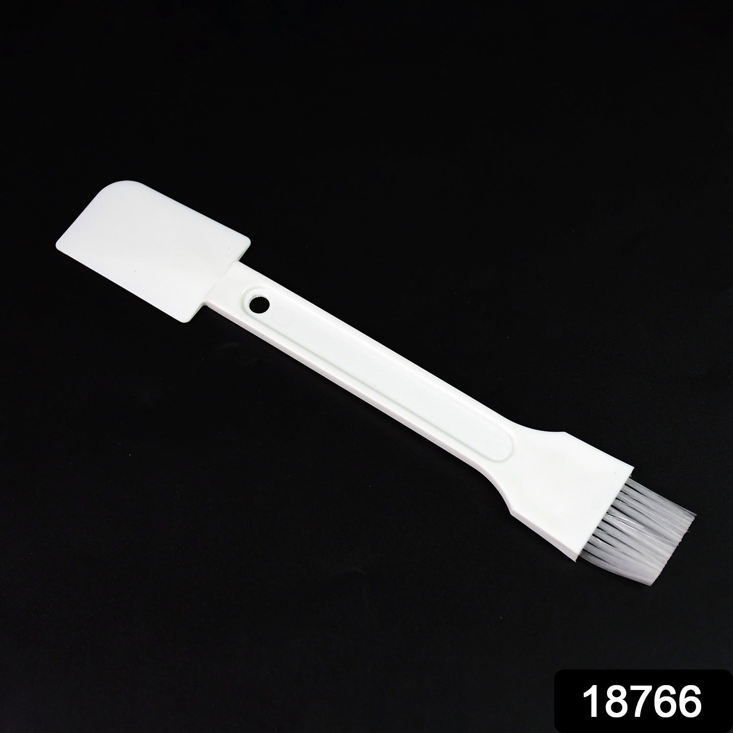 Small dust cleaning brush effectively cleaning keyboard keys.