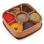 Plastic Masala Dabba with seven compartments, showcasing traditional rangoli design.