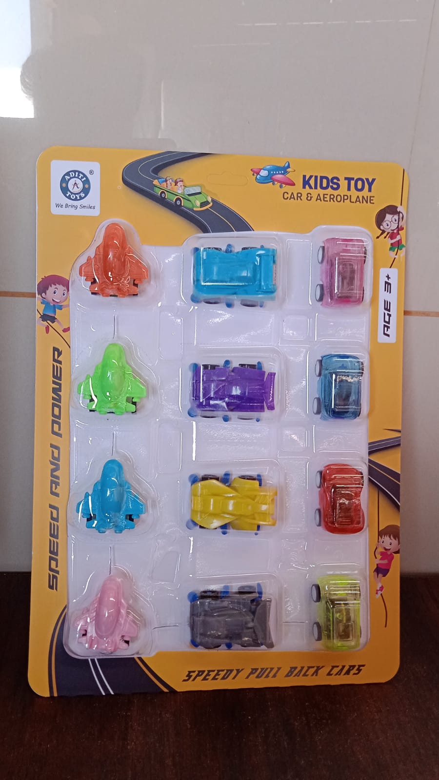 Collection of diverse mini pull back cars and planes for young children.