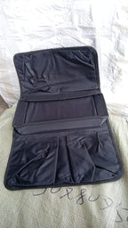 Lifestyle shot of the sofa armrest organizer keeping a living room tidy.