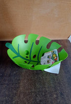 Decorative leaf-shaped fruit basket placed on kitchen countertop