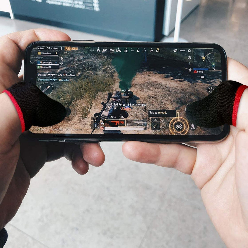 Gamer using black gaming finger sleeves on a smartphone during intense play.