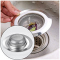 Close-up of a shiny stainless steel sink strainer showing its full hole pattern.