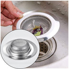 Close-up of a shiny stainless steel sink strainer showing its full hole pattern.