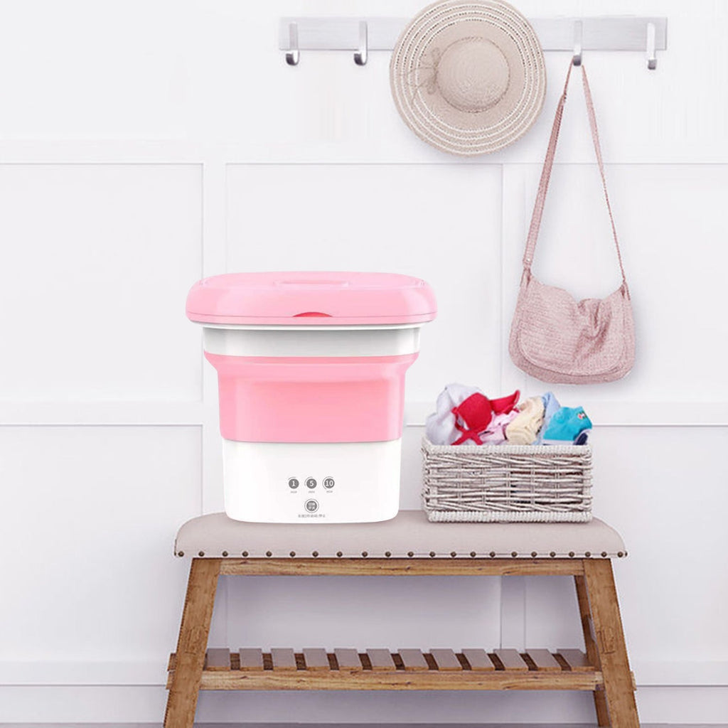Foldable mini washing machine demonstrating its space-saving design.