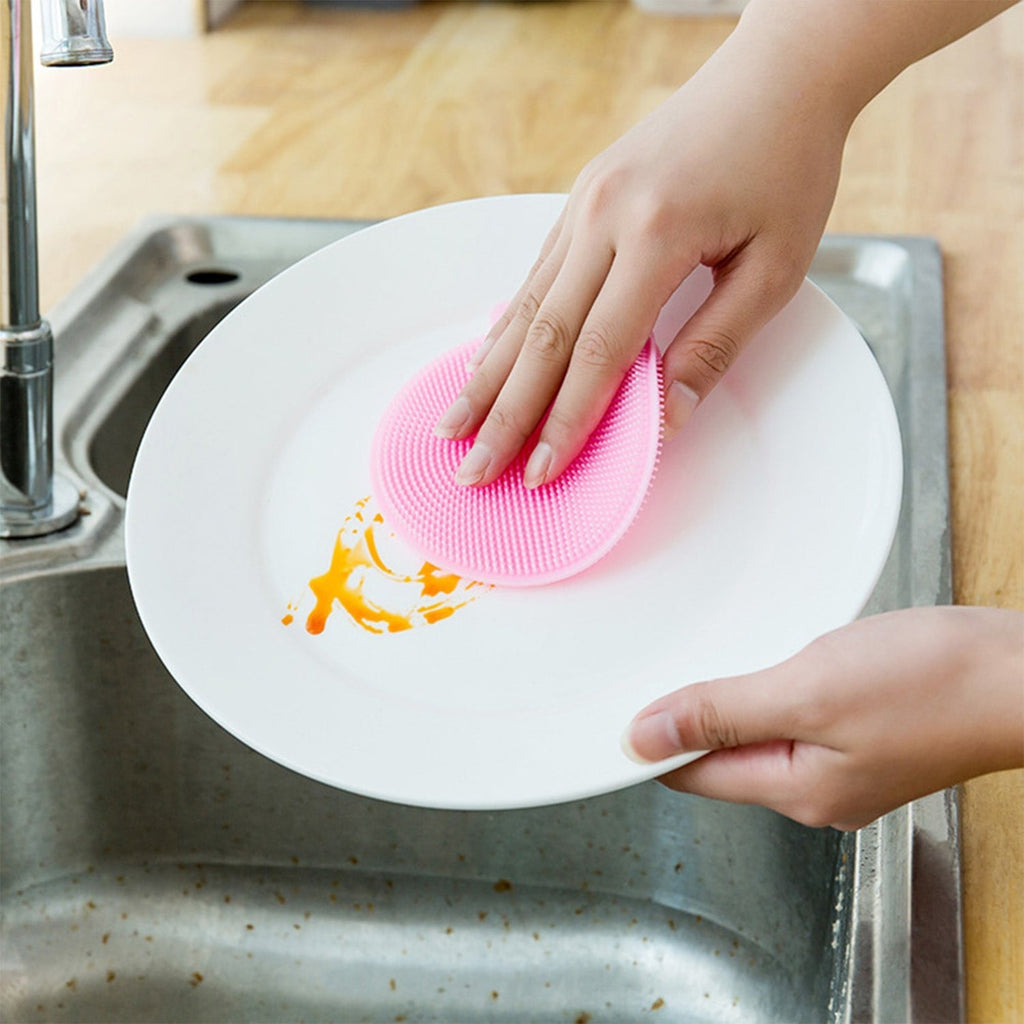 Close-up of a mildew-free silicone dish sponge in assorted colors, highlighting its gentle scrubbing bristles.
