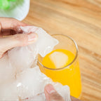 Disposable ice cube bags keeping drinks cold at a party setup.