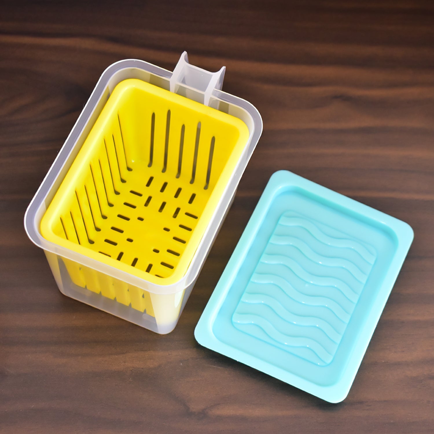 Modular fridge storage containers with lids, neatly arranged inside a modern kitchen fridge.