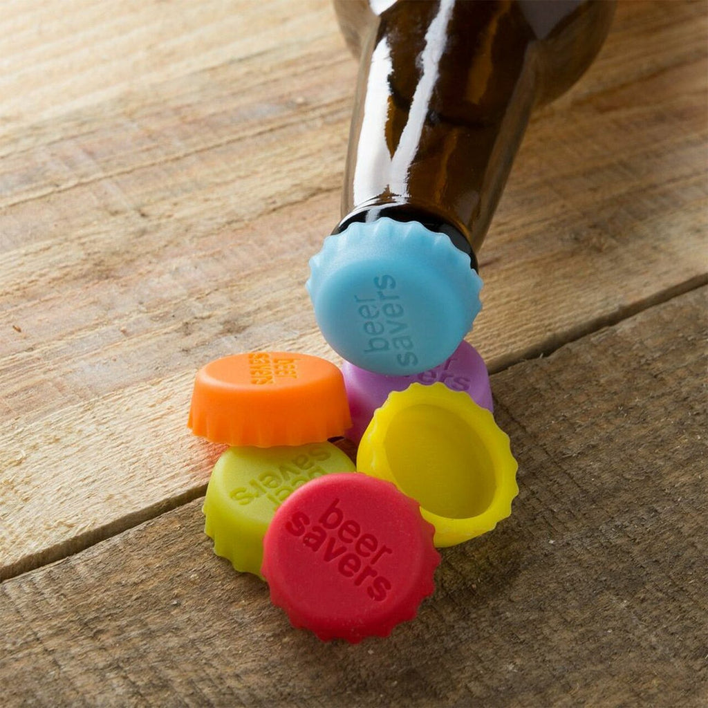 Brightly colored silicone bottle caps ready for use on drinks.