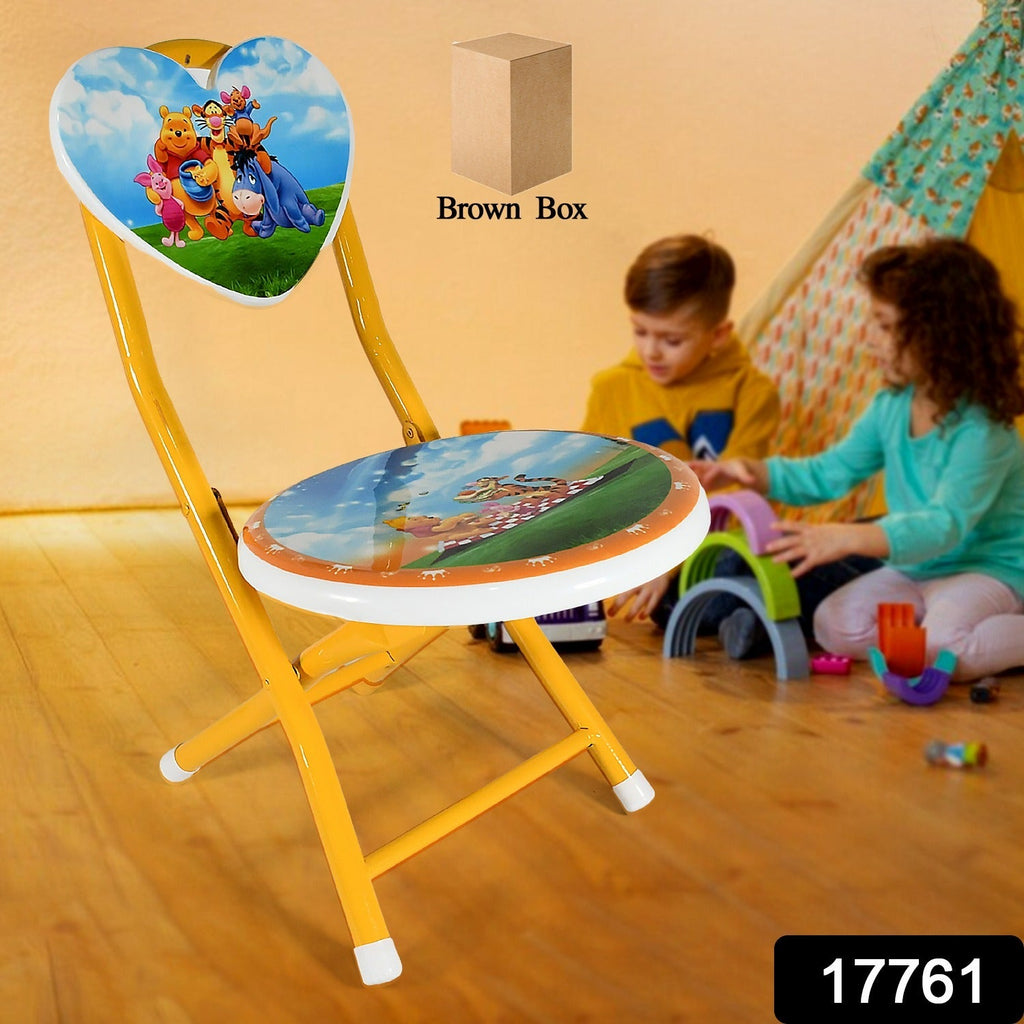 A happy child sitting comfortably on the portable heart design kids chair indoors.