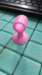 Mini silicone door stopper demonstrating multiple uses