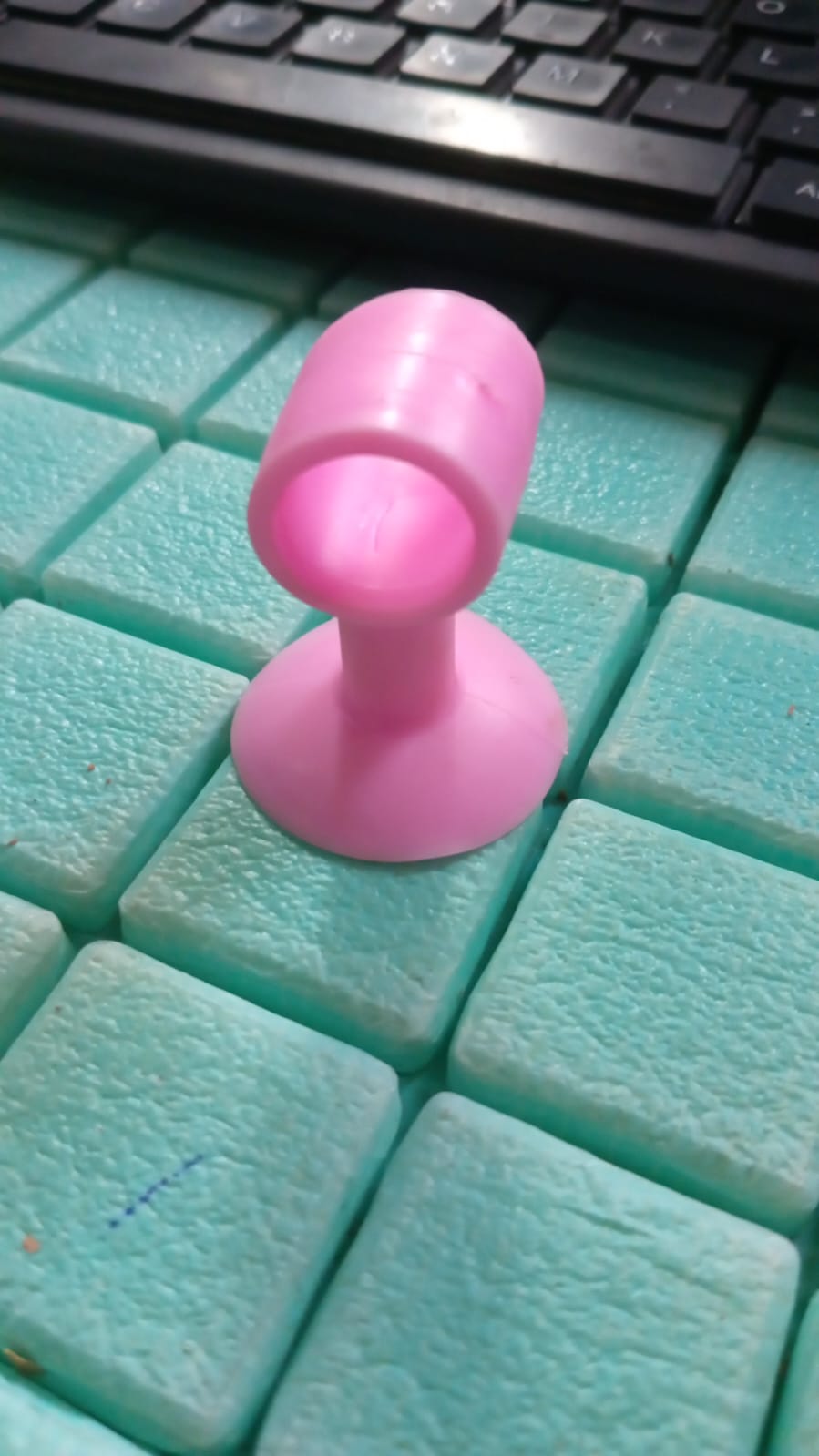 Mini silicone door stopper demonstrating multiple uses