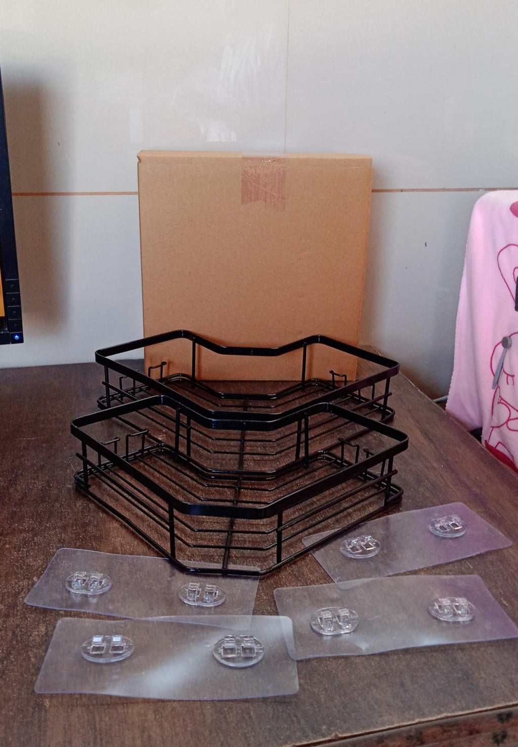 Packaging of the stainless steel iron-coated corner shelf organizer (2 Pc) with product features listed