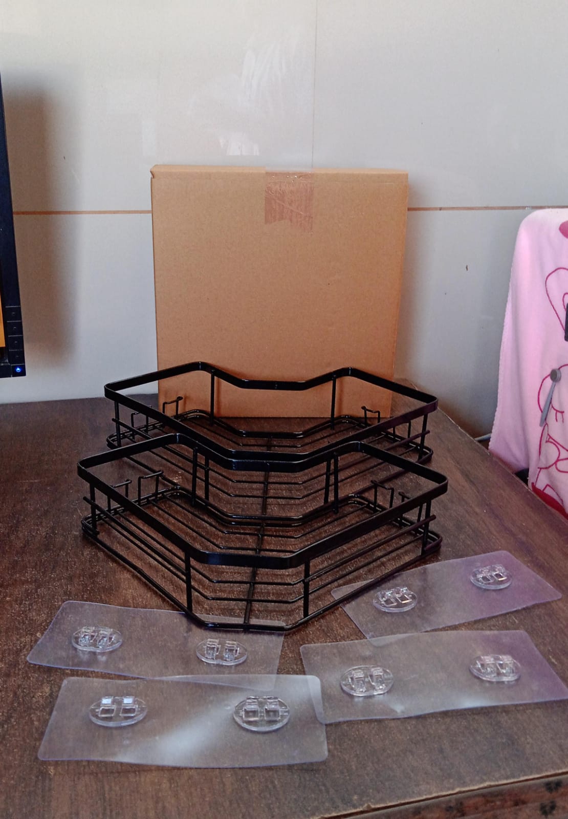 Packaging of the stainless steel iron-coated corner shelf organizer (2 Pc) with product features listed