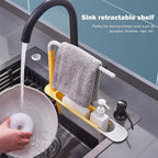 Side view of the sink rack highlighting its integrated bar for hanging dishcloths to dry.