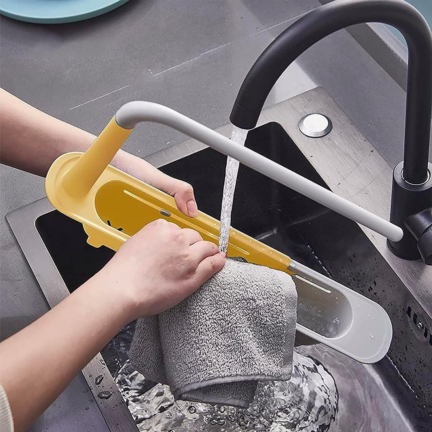 The compact sink caddy shown at its shortest length, fitting smaller sink areas.