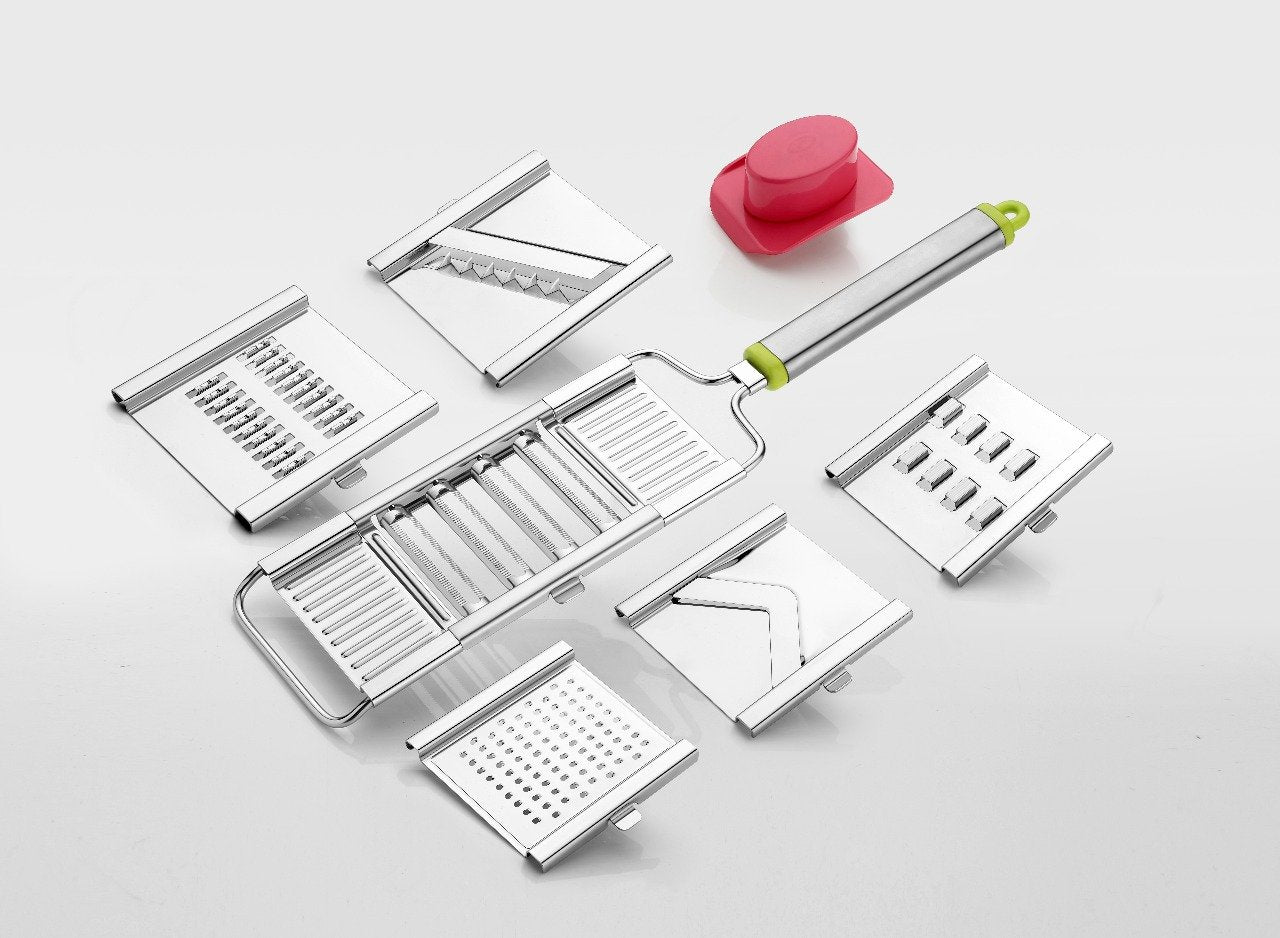 Stainless steel vegetable chopper with multiple interchangeable blades.