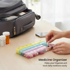 Open weekly pill case with vibrant multicolored lids displayed for easy organization.