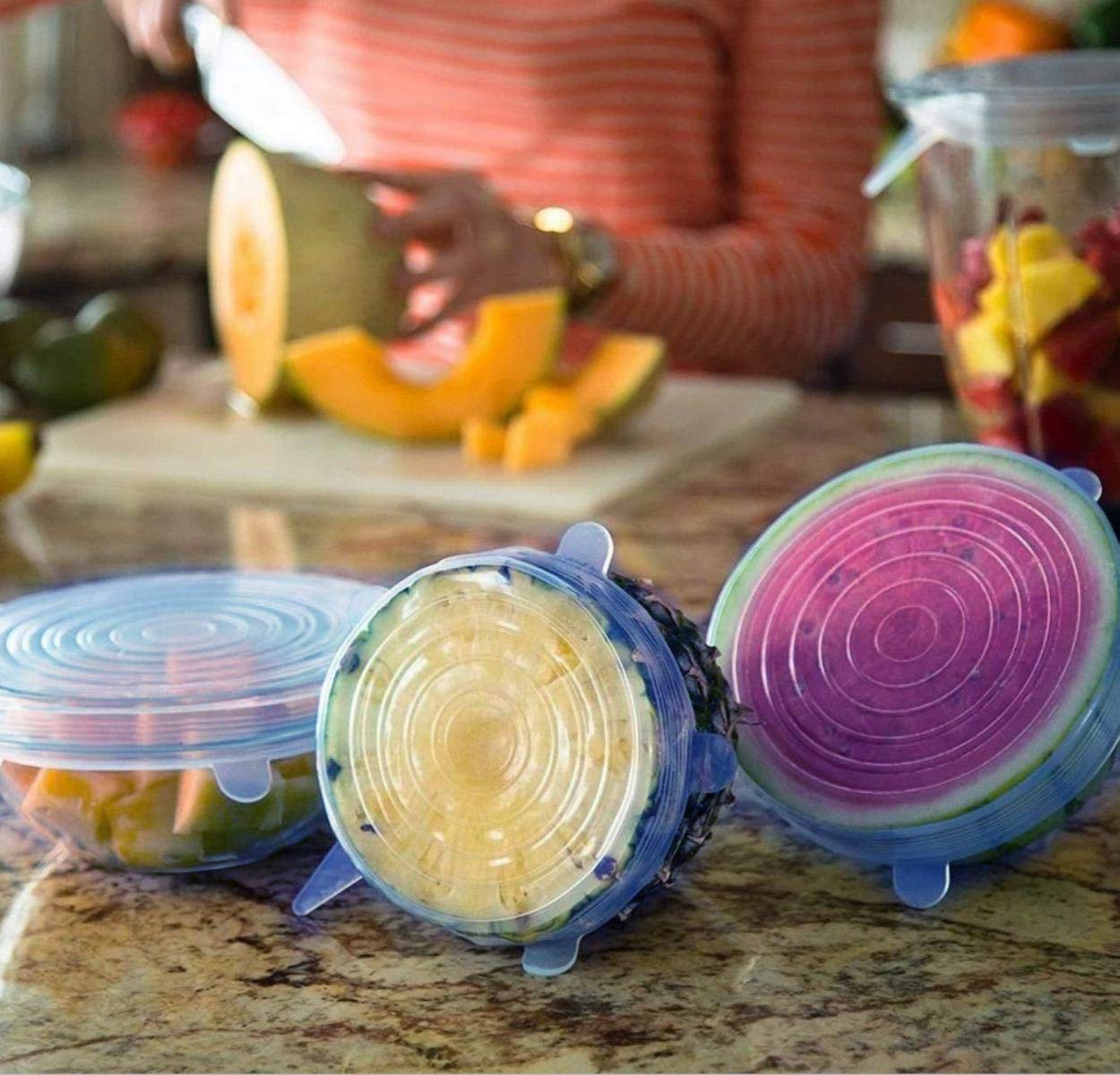Airtight silicone food cover stretching over a bowl of fresh vegetables.