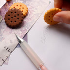 Set of 6 biscuit-shaped erasers in a clear display box, perfect for kids' stationery.