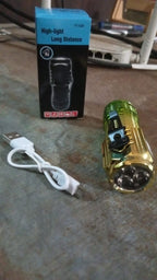 Handheld view of the mini 3 LED flashlight, emphasizing its compact and ergonomic design.