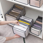 Empty Organivo 7 Grid Clothes Organizer, highlighting its foldable structure.