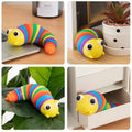 Vibrantly colored 3D rainbow plastic slug fidget toy twisting playfully on a surface.