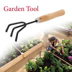 Ergonomic black handle of the steel hand cultivator, designed for comfortable use.