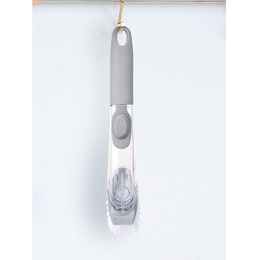 Close-up of the liquid dispensing dish cleaning brush bristles and scraper.