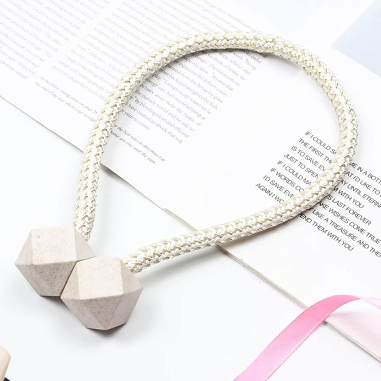 Side view of a pearl curtain tieback securing a thick curtain, demonstrating its versatility.