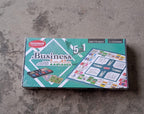 Close-up of plastic money, game board, and pieces for the business learning game.