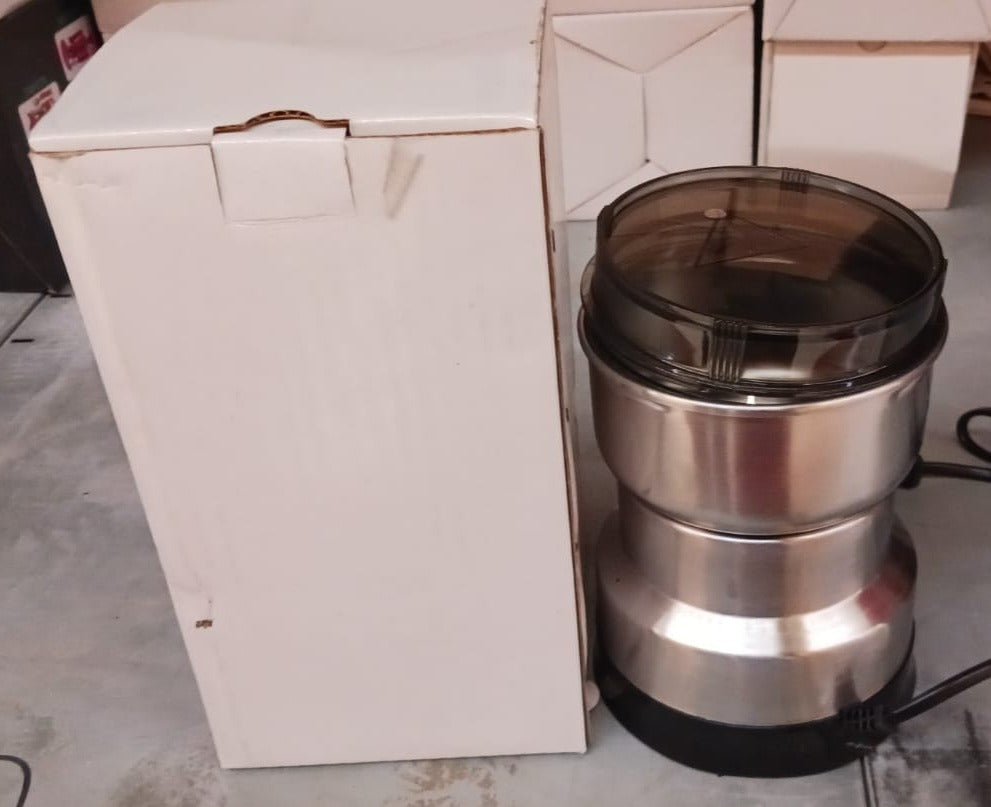 Contents of the ChefAura mini electric grinder package, including instructions.