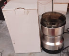 Contents of the ChefAura mini electric grinder package, including instructions.